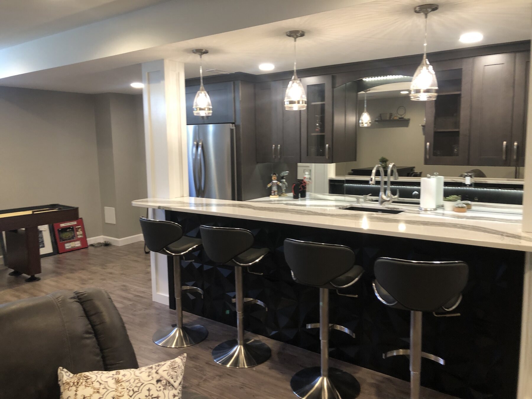 Completed custom bar in a finished family basement