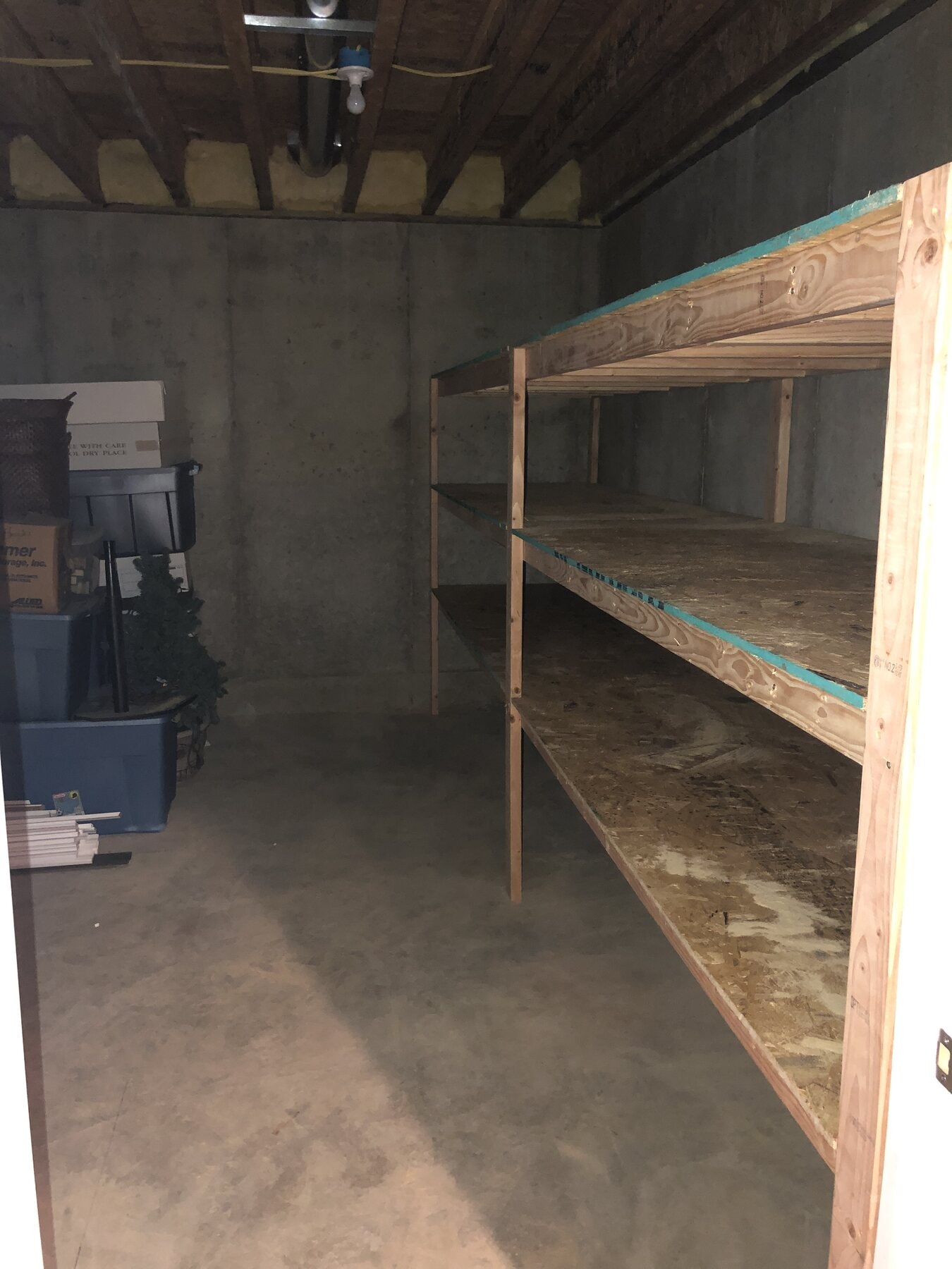 Organized storage area in the finished basement