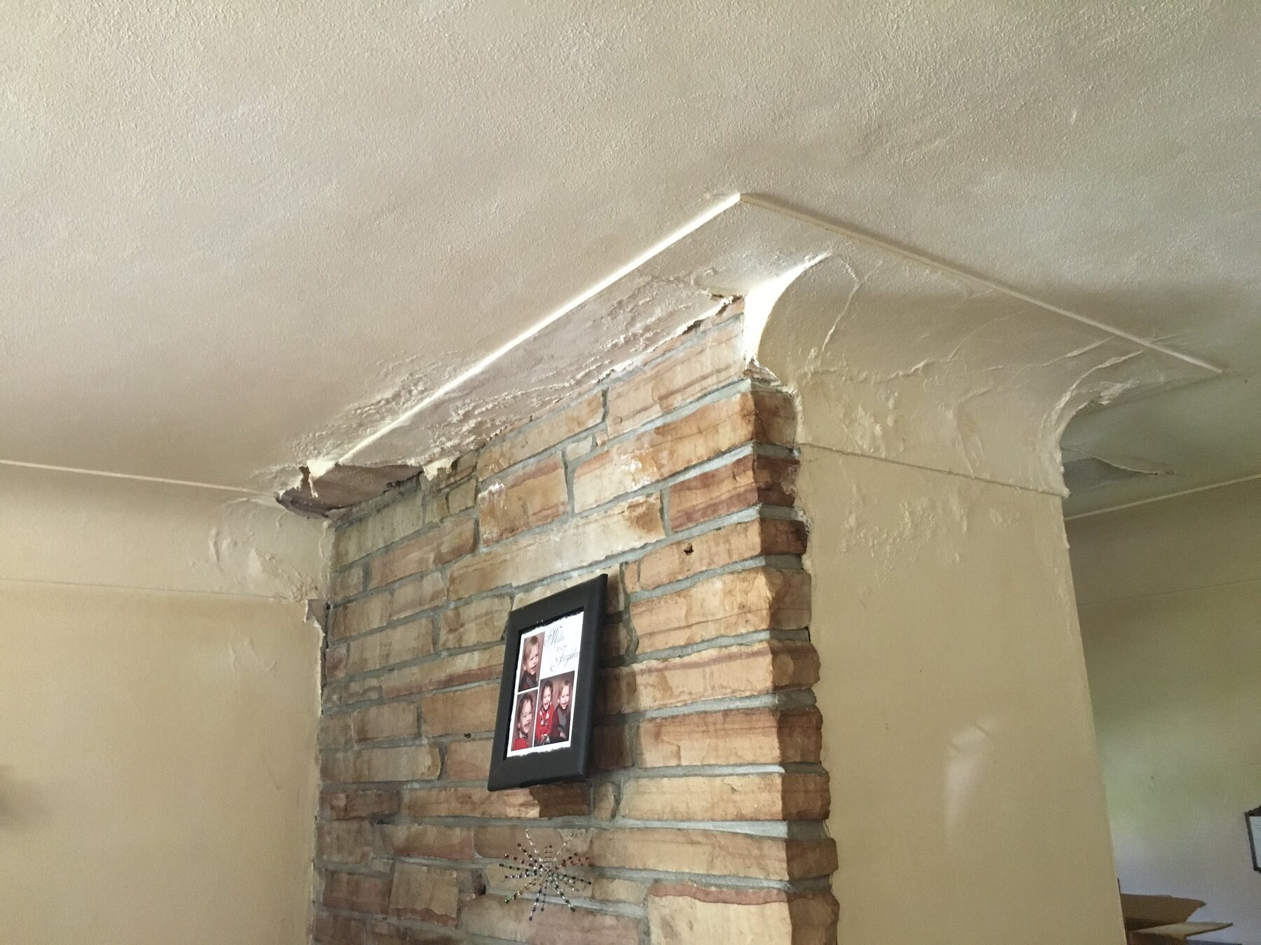 Living room and existing fireplace before the whole-house refresh